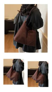 Grand sac cabas en daim marron avec poche extérieure pratique et texture douce élégante