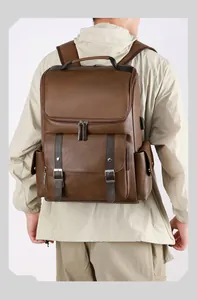 Detailed back view of vintage brown PU leather backpack with integrated USB charging port