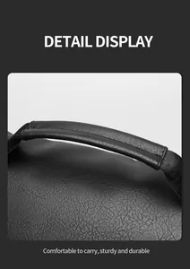 Detail display of the black leather backpack handle and durable nylon shoulder strap