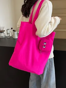 Sac fourre-tout pliable en toile avec broderie monstre rose et petit porte-monnaie