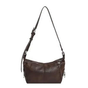 Retro dark brown leather half-moon shoulder bag with adjustable strap and star charm