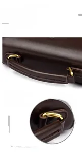 Macro detail of reinforced brown leather handle and gold hardware on doctor bag