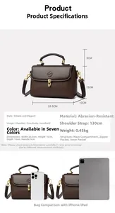 Detail of small brown leather doctor bag with size comparison to phone and tablet