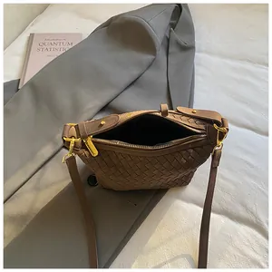 Retro dark brown woven shoulder bag with golden zipper and vintage textured leather