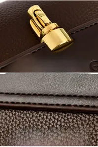 Close-up of golden metal twist lock on brown lychee grain leather square handbag