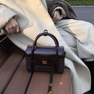 Retro color-block square handbag with gold COIN 2DN logo and dual top handles