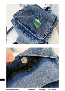 Détail du mini sac à dos en jean avec fermoir magnétique et poche vintage effilochée