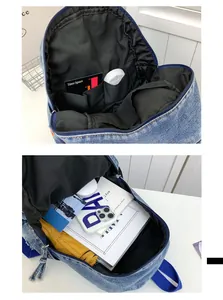 Détails de l'intérieur d'un mini sac à dos en jean avec poches de rangement et doublure