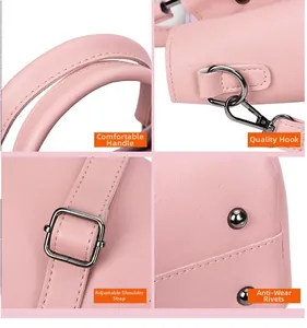 Detailweergave van roze emmertas met litchi-textuur en metalen hardware