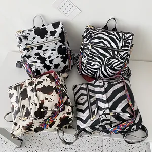 Retro PU leather backpack set with cow and zebra patterns and ethnic woven straps