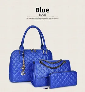 Detailed set of blue quilted tote, crossbody chain bag and matching wallet with gold charms