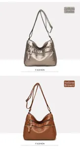 Close-up of dual-color soft faux leather shoulder bags with multiple zipper pockets