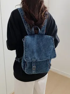 Mochila de mezclilla lavada retro de gran capacidad para viaje en modelo real
