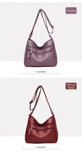 Detailed view of women's crossbody bags in purple and wine red with lychee texture