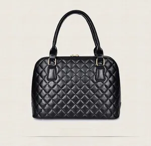 Back view of black quilted tote bag with diamond stitching and gold hardware