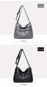 Detail of multi-zippered crossbody bags for elderly women in gray and black finishes