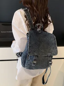Mochila de mezclilla lavada vintage con hebillas plateadas y gran capacidad de viaje