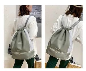 Detail view of the drawstring sports backpack with bottom shoe compartment and side mesh