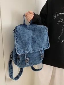Mochila de mezclilla lavada vintage con hebilla metálica para viajes y diario