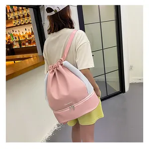 Pink drawstring gym bag for women showing dry-wet separation compartment and mesh detail