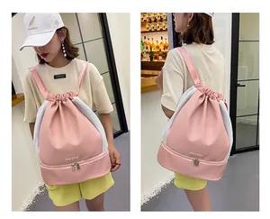 Pink drawstring gym bag detail showing dry-wet separation and bottom shoe compartment