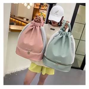 Pink and green drawstring sports backpack with separate bottom shoe compartment