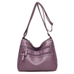 Practical purple faux leather shoulder bag with multiple zippers and adjustable strap