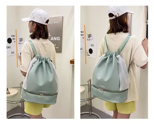 Detail of mint green gym backpack featuring breathable mesh and separate shoe compartment