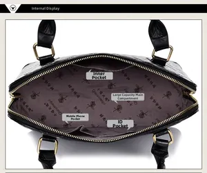 Interior view of black quilted handbag featuring multiple functional storage pockets