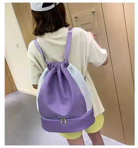 Detail view of purple gym bag featuring ventilated mesh sides and separate shoe compartment