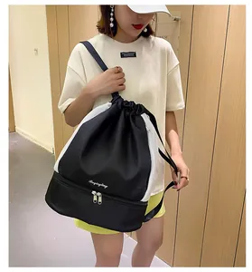 Detail of drawstring gym bag showing breathable mesh side and bottom shoe compartment