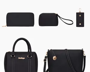 Detail of five-piece black lychee pattern handbag set with elegant gold hardware