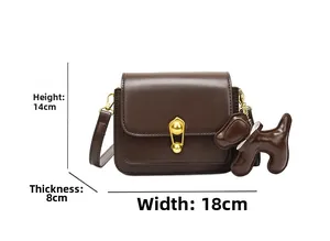 Brown leather crossbody bag detail with gold ball lock and dimensions 18x14x8cm