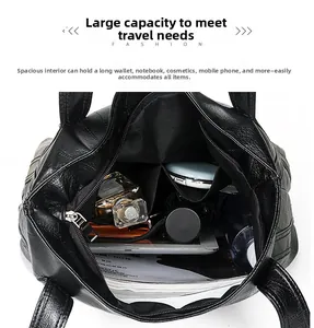 Interior view of black washed PU leather tote bag showing large capacity and inner pockets