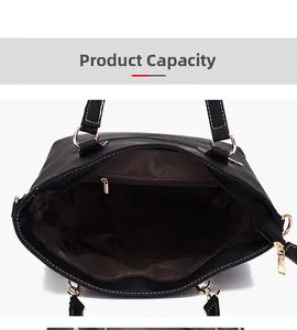 Interior view showing the large capacity and multiple pockets of the black leather handbag