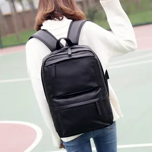 Minimalist black PU leather backpack for men with multi-zipper pockets for outdoor travel