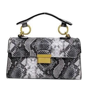 Chic black and gray snakeskin pattern crossbody bag with golden chain and clasp detail