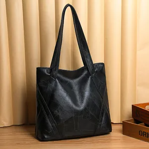 Classic black washed leather tote bag for women with spacious minimalist vintage design