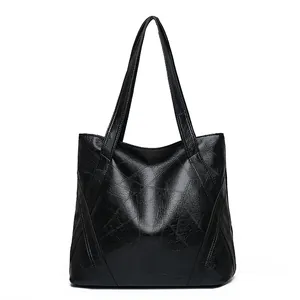 Large black washed leather tote bag for women with minimalist geometric stitching