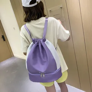 Purple drawstring gym backpack for women with separate shoe compartment and mesh sides