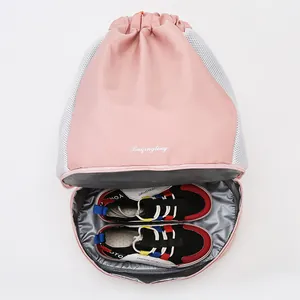 Pink drawstring gym bag with breathable mesh and separate shoe compartment at the bottom