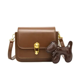 Minimalist brown PU leather crossbody bag with gold lock and cute dog charm pendant
