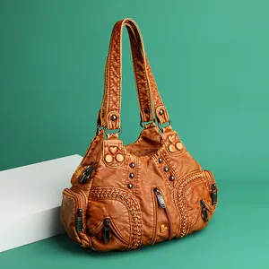 Vintage caramel washed leather shoulder bag with multi-pocket design and metallic studs