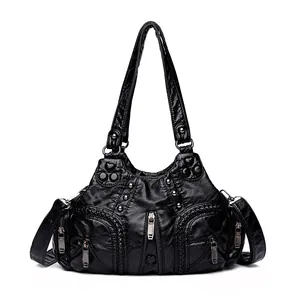 Klassische schwarze Vintage-Handtasche für Damen mit Reißverschlüssen und Nieten