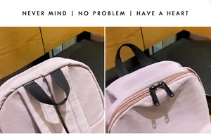 Detalle de mochila rosa con asa negra resistente y cierre de doble cremallera metálica
