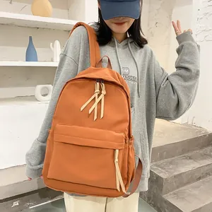 Minimalist caramel brown high-density nylon backpack for college students and casual commuting