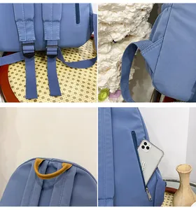 Detail of adjustable straps and hidden anti-theft zipper pocket on blue canvas backpack