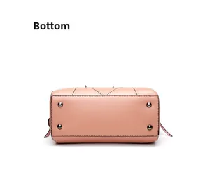 Pink matte leather bag base with four dark metal feet for bottom protection