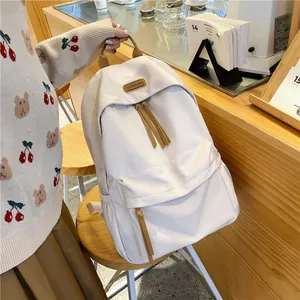 Minimalist beige campus backpack with brown straps and large capacity for students
