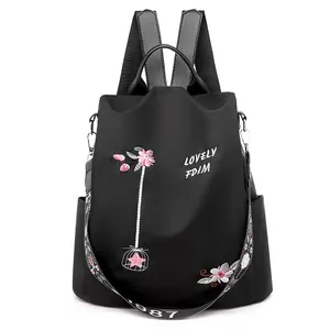Classic black floral embroidered backpack with wide jacquard strap and side pocket